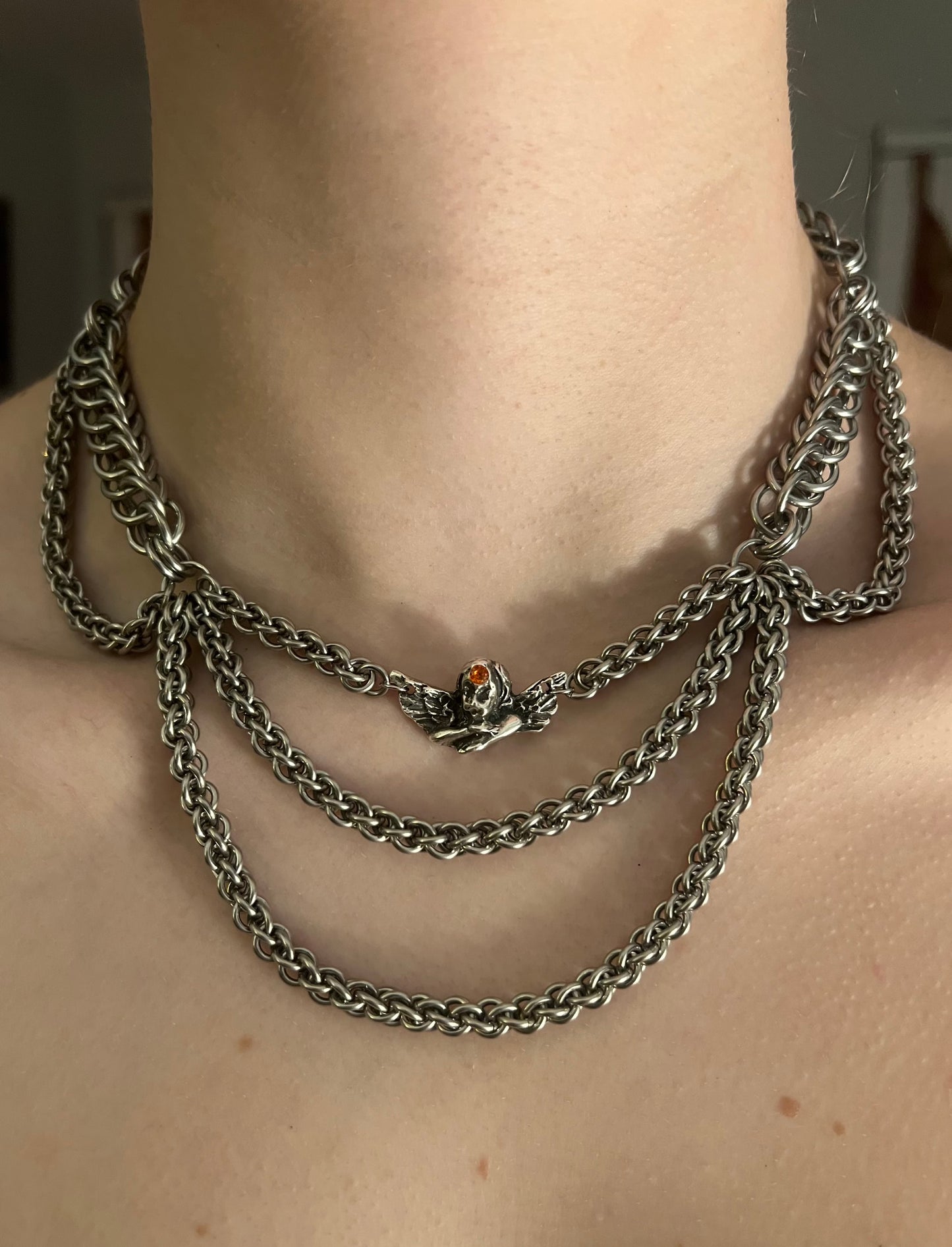 Three-eyed angel necklace